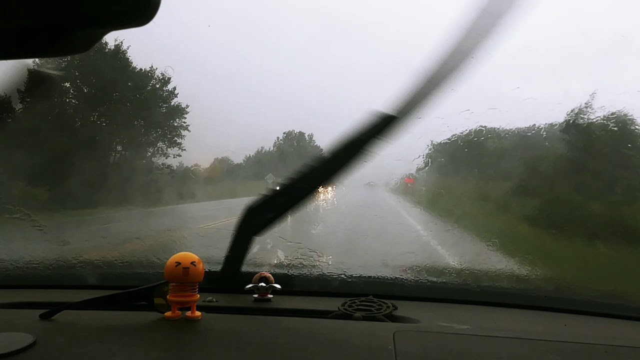 Driving in heavy rain .  Some flooding.