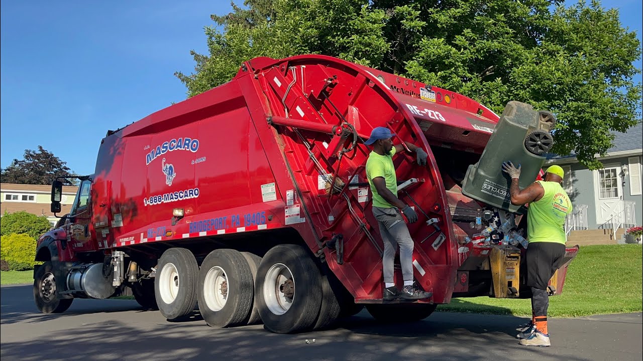 JP Mascaro International McNeilus rear loader garbage truck flying through recycle