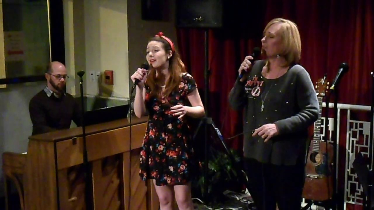Mary Payne Omohundro, Barbara Lawson, and Brandon Heishman sing 