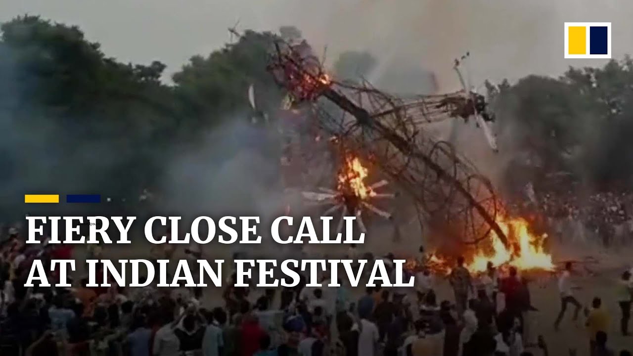 Festival-goers escape death as huge burning effigy collapses during Dussehra celebrations in India