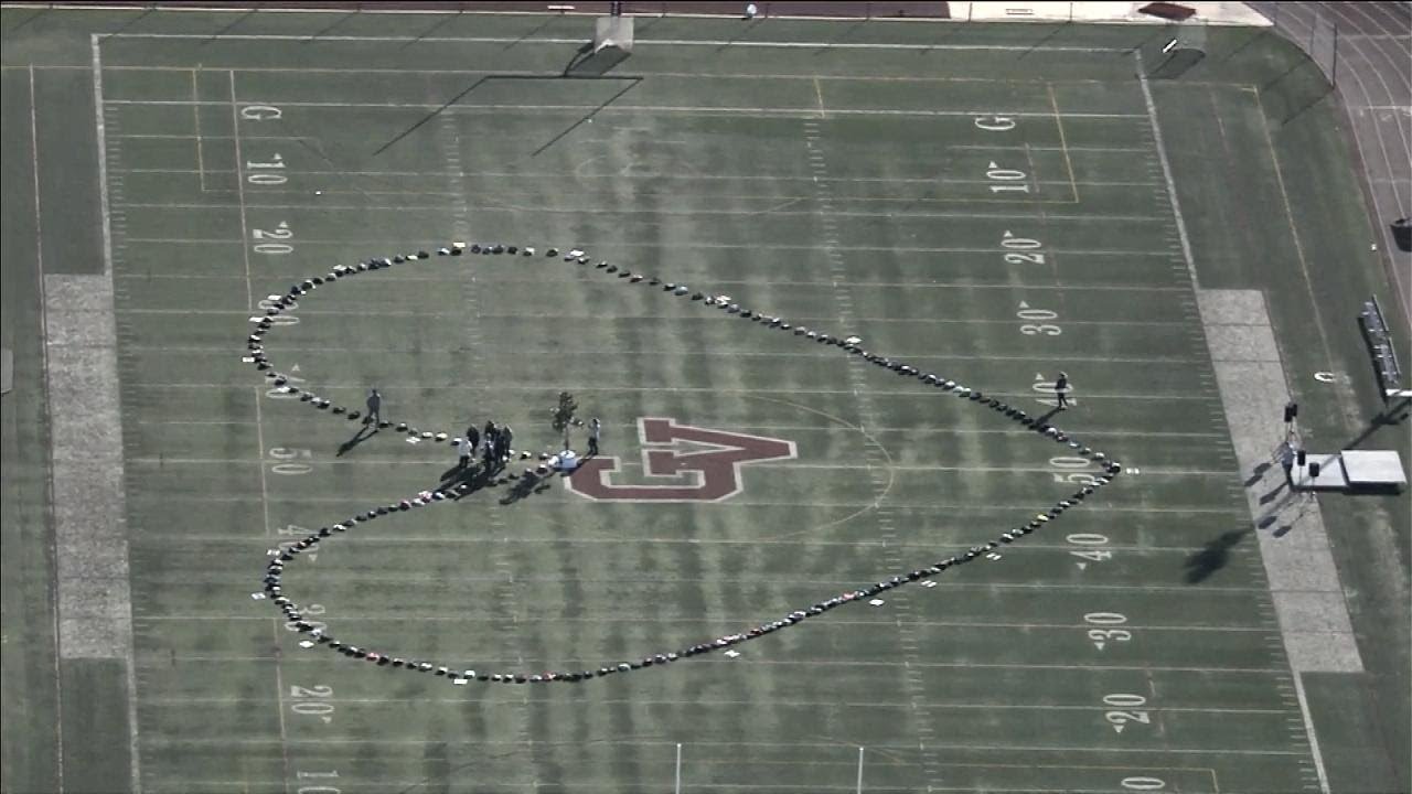 Students Arrange Backpacks in the Shape of a Heart During Walkouts