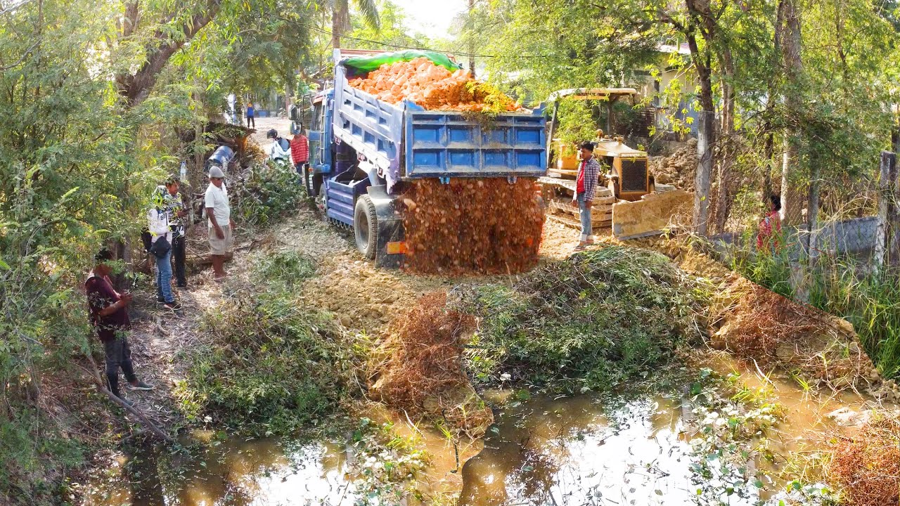 New Action Project Bulldozer Pushing The Rock Fill Pond In The Village