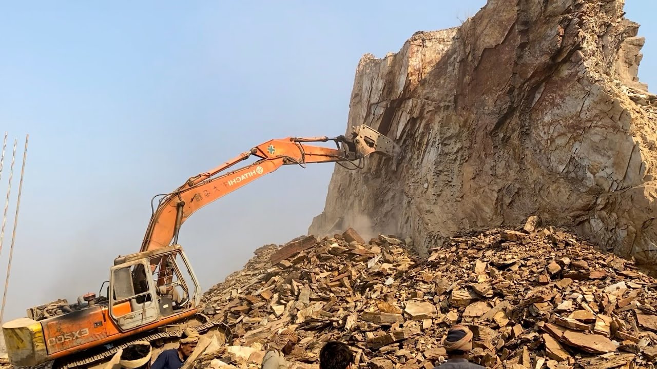 Amazing excavator performance | Breaking huge rocks with powerful machinery 💯
