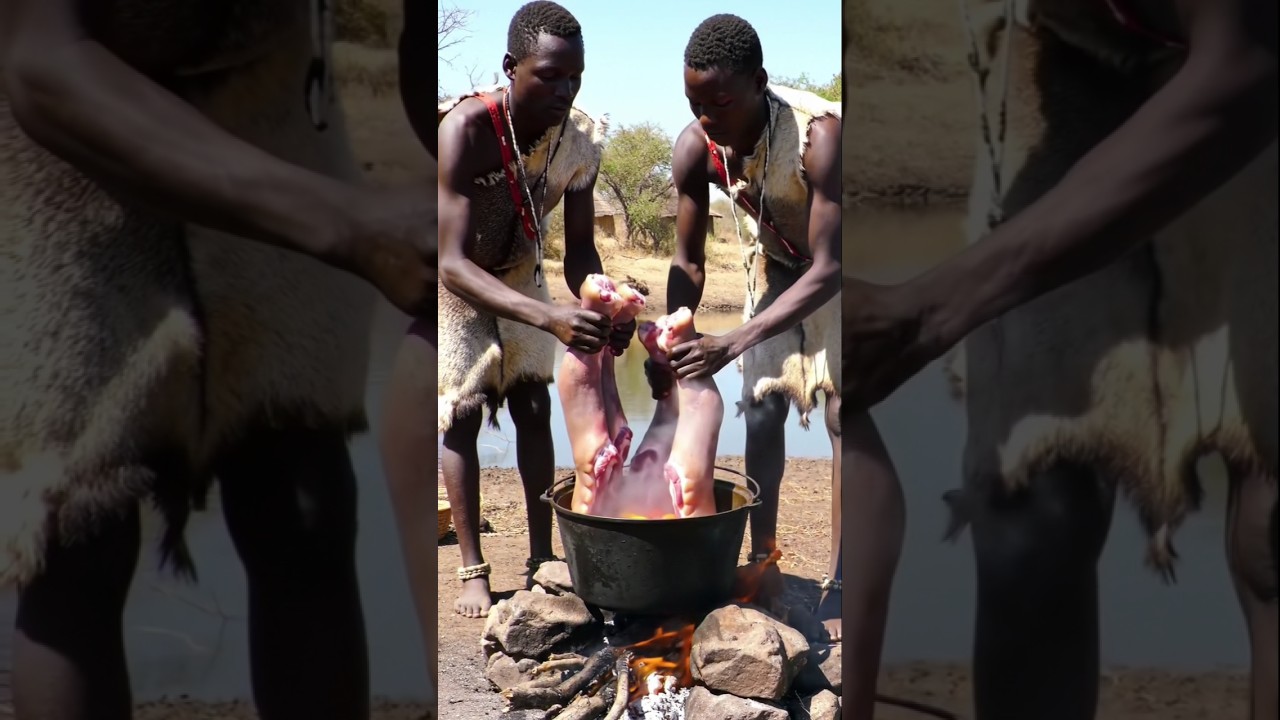 African Tribe Boils Hippo Legs in a Massive Pot! 🍲🌍 #africa #hadzabetribe #wildcooking #viralshorts