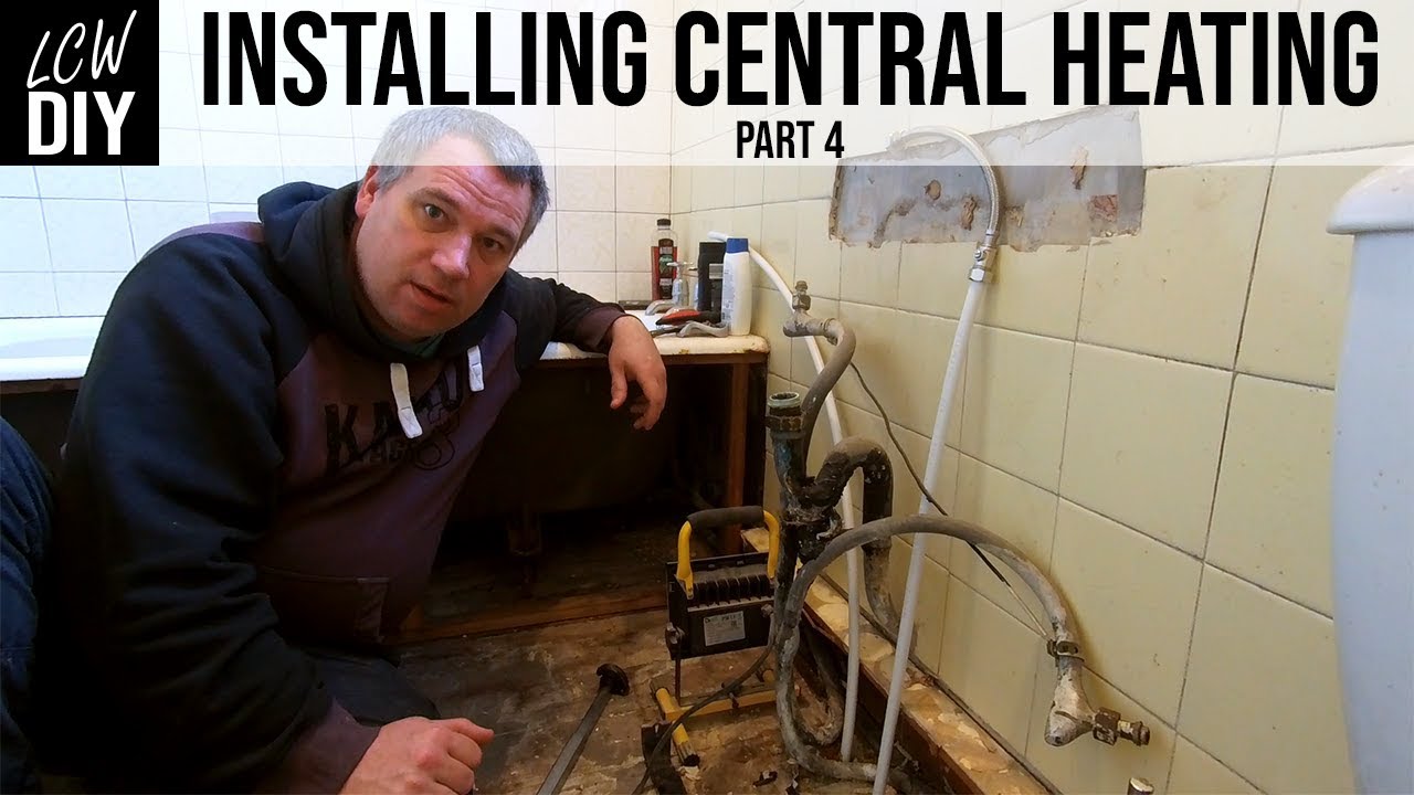 How to Install a Central Heating System part 4 - The boilers in and we run new pipes DIY Vlog #13