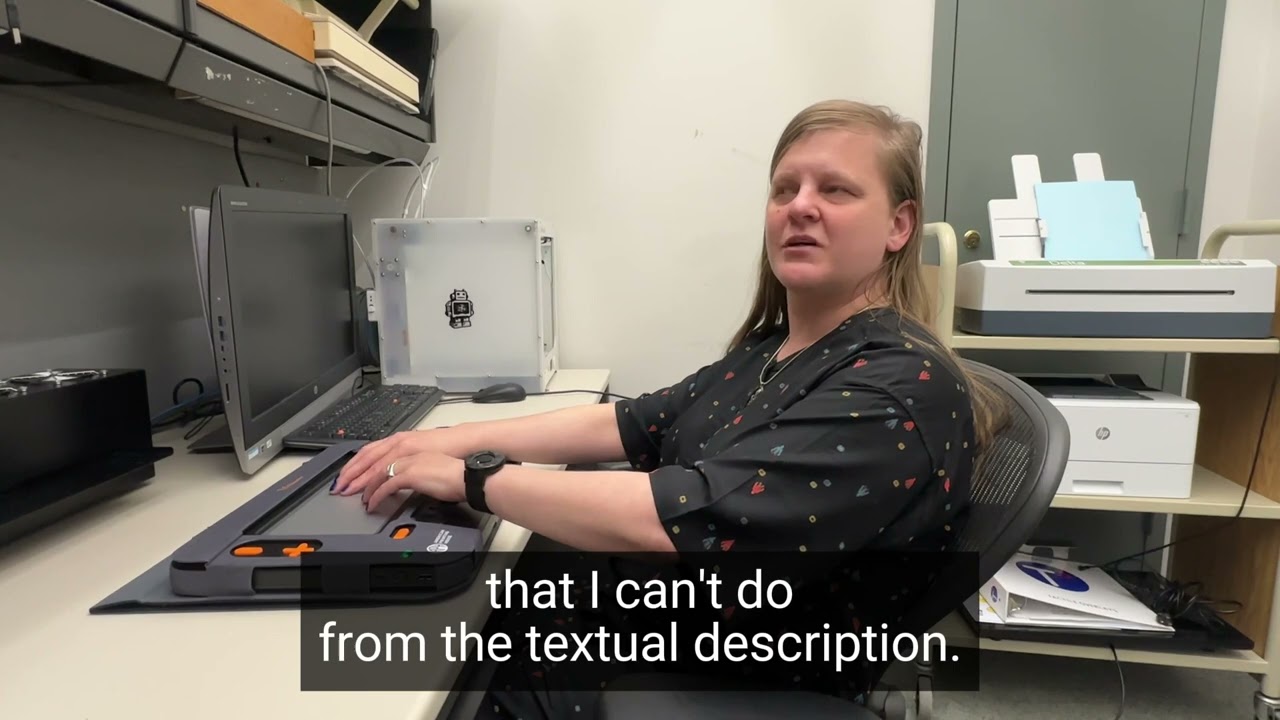 Chancey Fleet demonstrates the Monarch Braille Device at New York Public Library