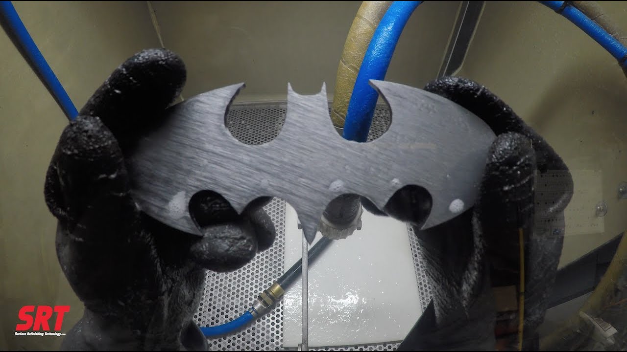 Batman Emblem Cleaned by Vapor Honing | Surface Refinishing Technology