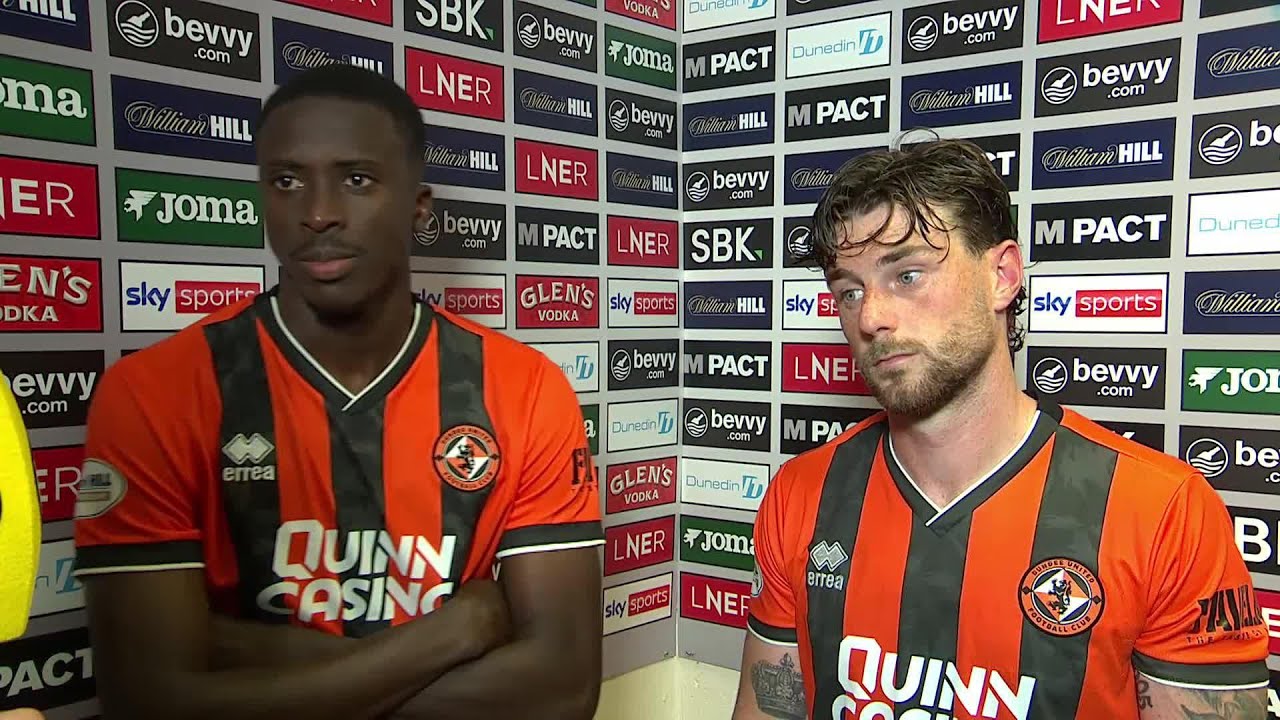 Dundee United's Panutche Camara and Will Ferry react to drawing 3-3 against Hibernian