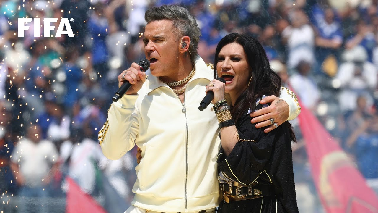 Robbie Williams and Laura Pausini perform 'Desire' at the FIFA Club World Cup