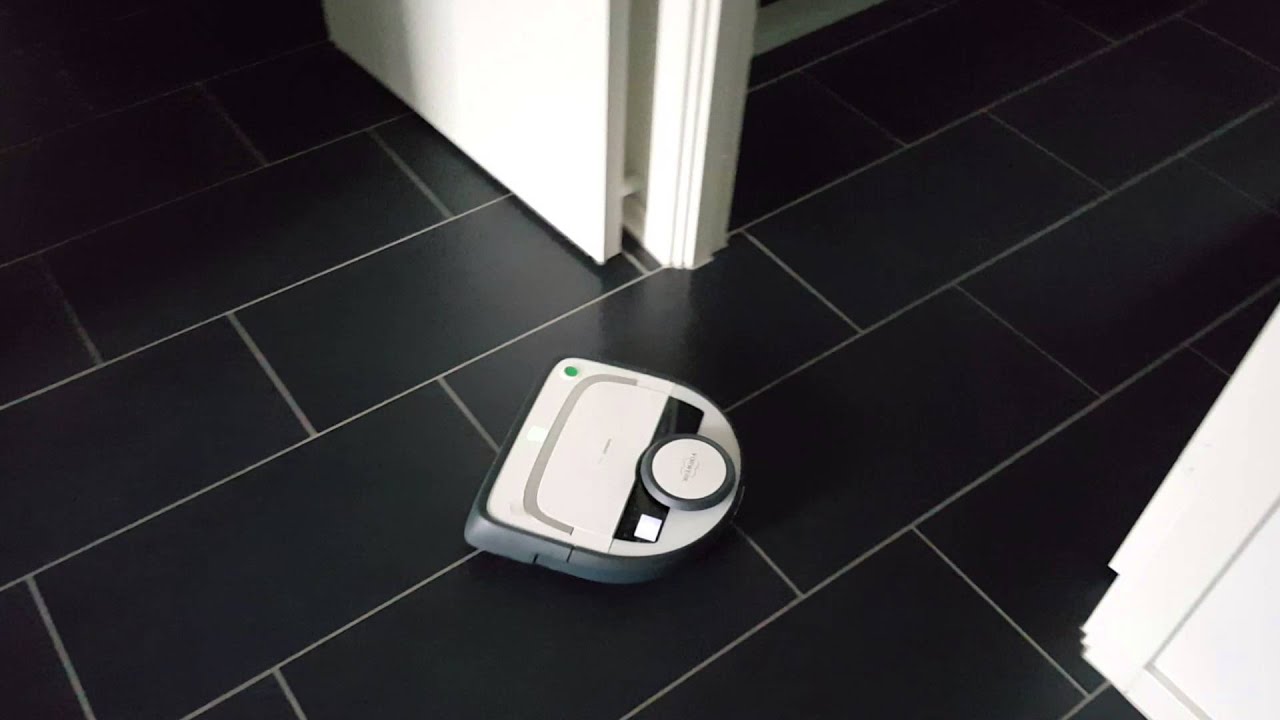 Vorwerk VR200 cleaning dock and emptying dust bin.