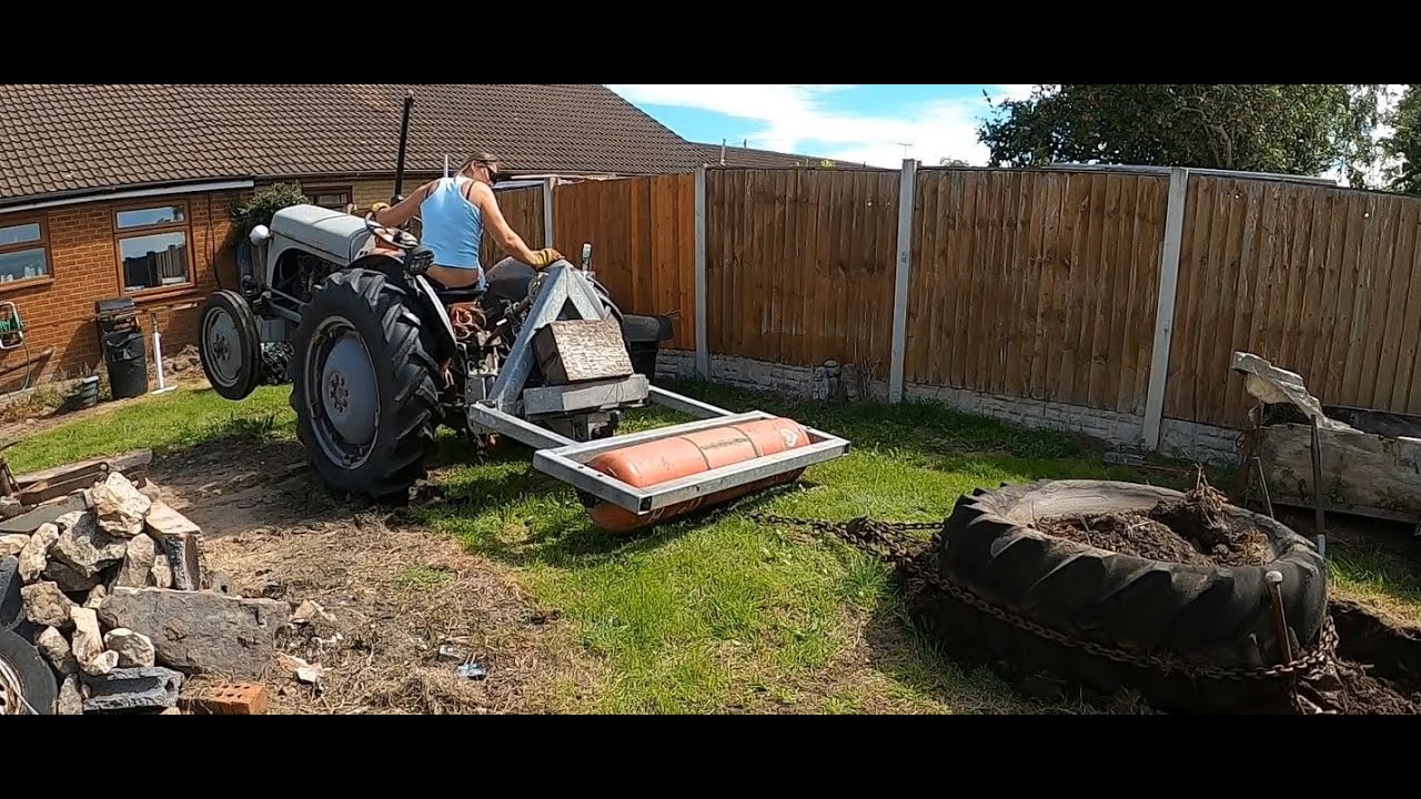 Ferguson T20 moving a tractor tyre and wheelie!