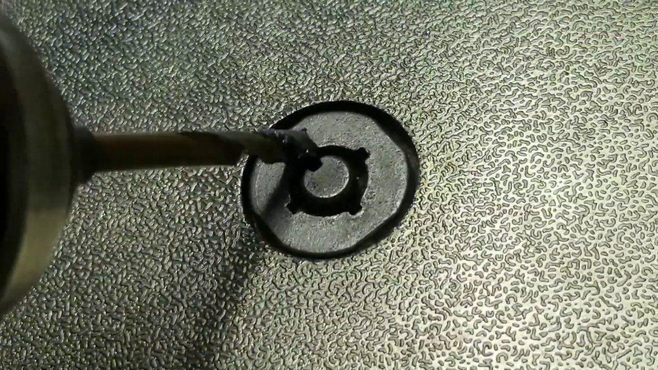 Drilling out a tubular lock. This is an 1-800 vending machine.