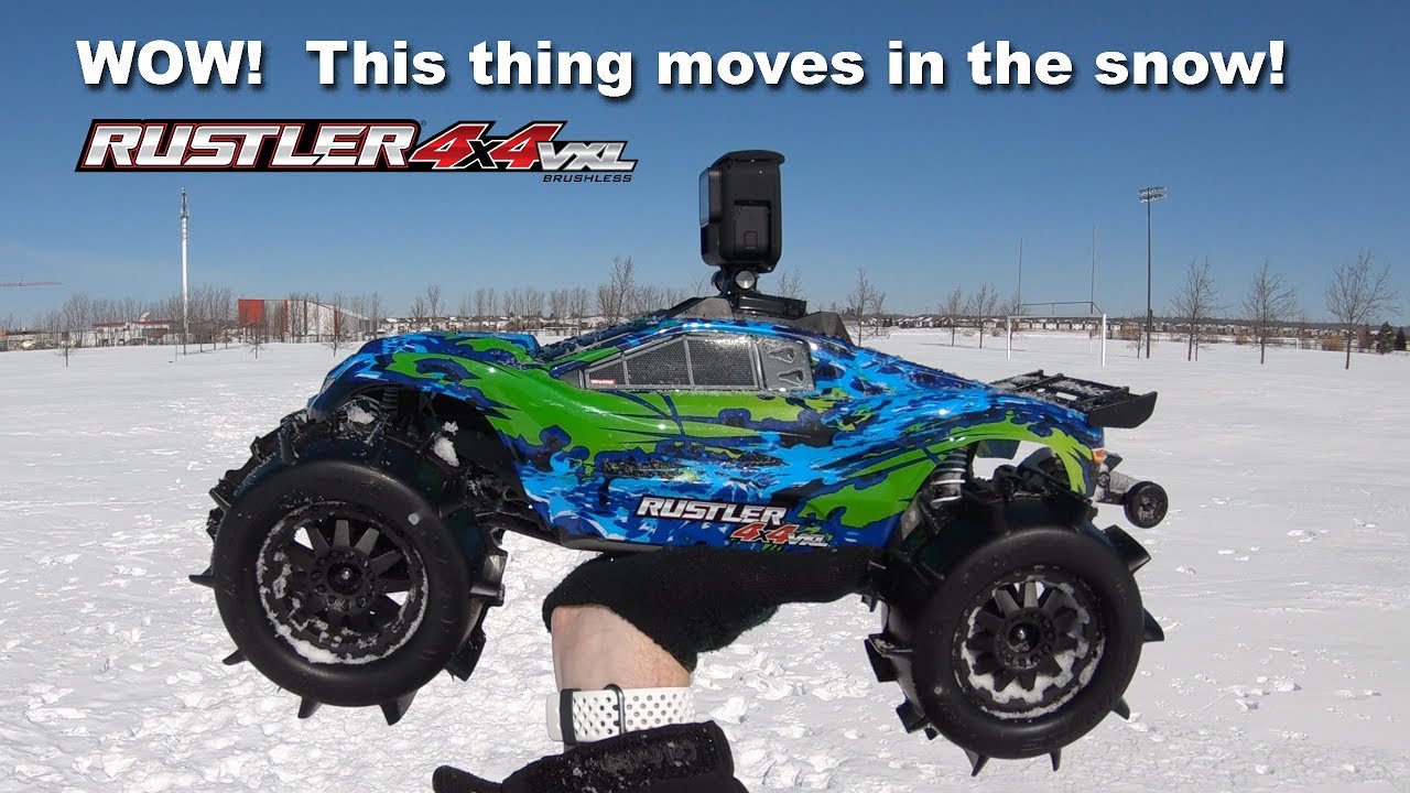 Driving Crazy Fast in SNOW with Sand Paw Paddle Tires - Traxxas Rustler VXL 4X4