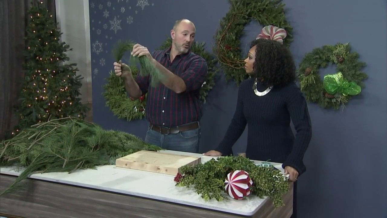 A homemade fresh greenery holiday wreath