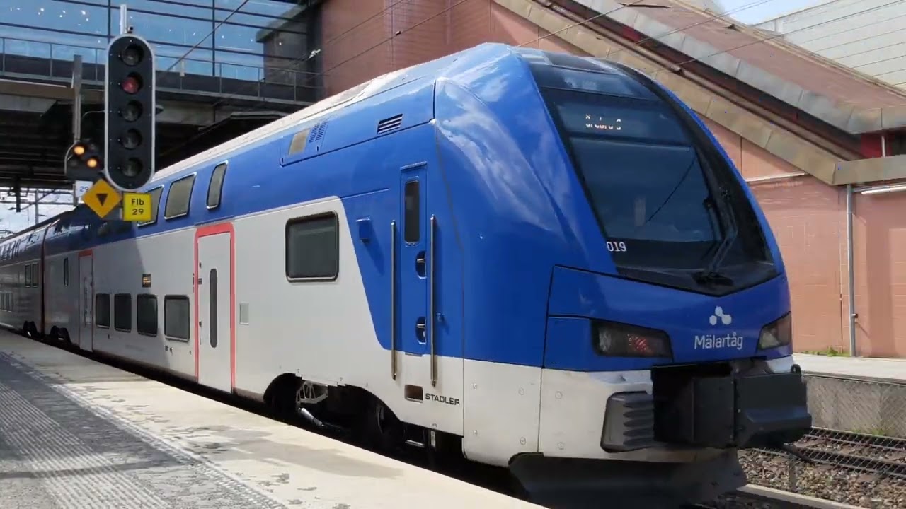 Sweden, Stockholm, Flemingsberg train station, 2X escalator + double decker train departure