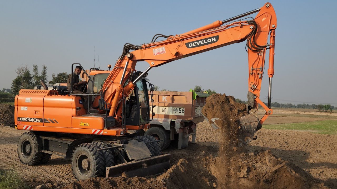 Powerful Develon DX140W Excavator Soil Loading | Heavy Duty Dump Trucks Worksite Action
