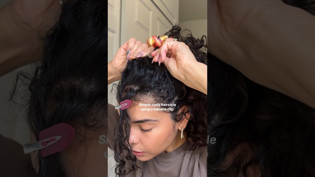 Simple curly hairstyle with a banana clip