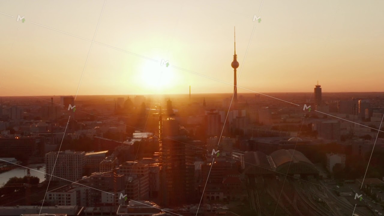AERIAL: Flight over Berlin, Germany at beautiful Sunset, Sunlight and view on Alexanderplatz TV