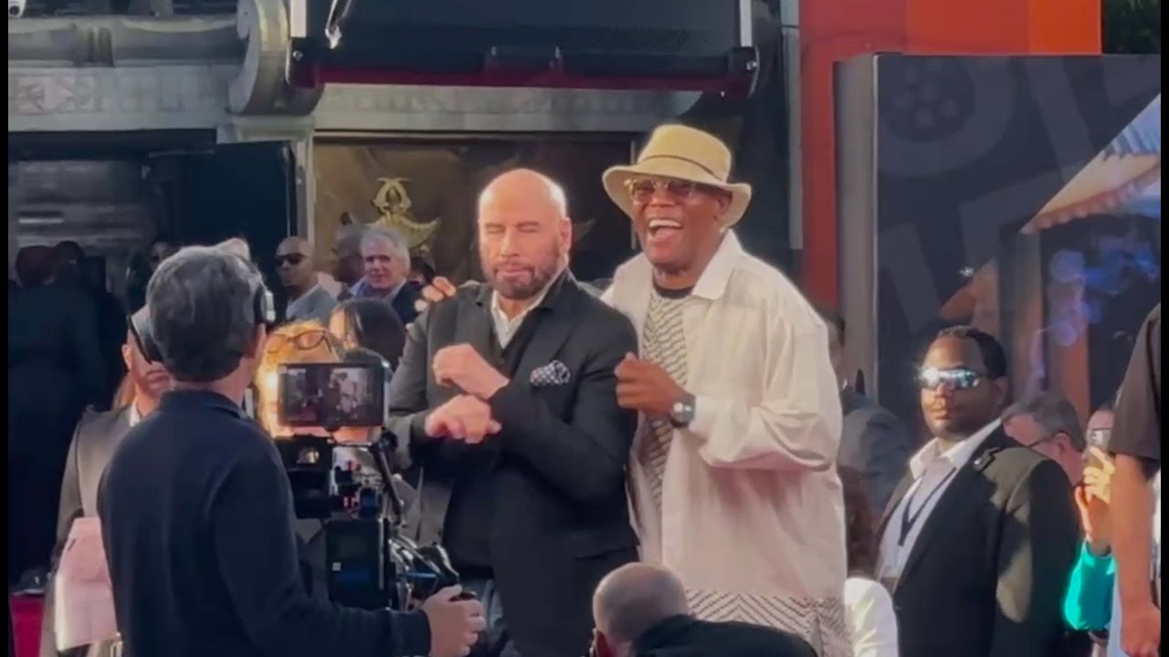 John Travolta showing some moves to Samuel Jackson