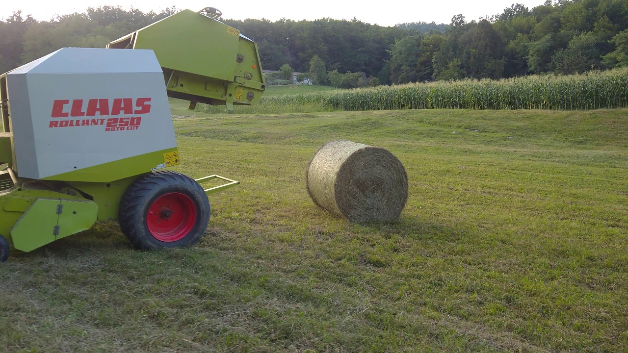 John Deere 6400 and round baler Claas rollant 250
