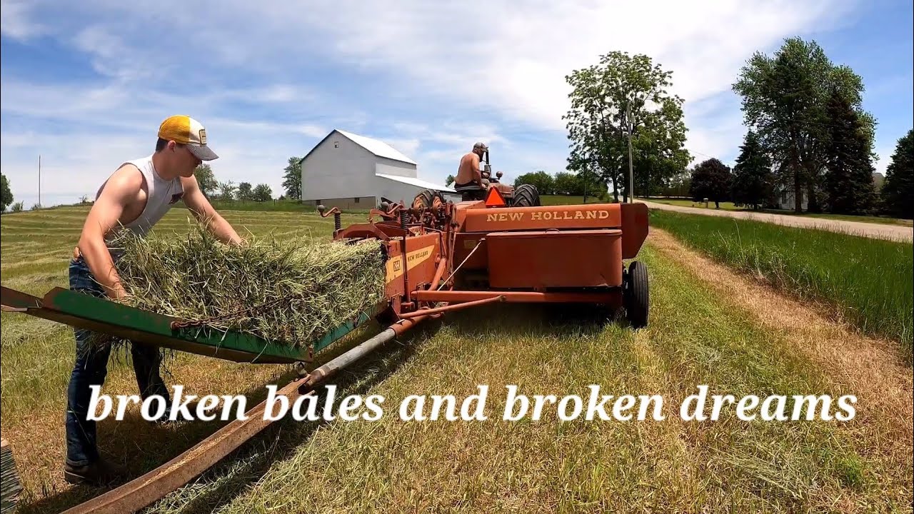 Bailing Hay with farmall M and New holland hayliner 269