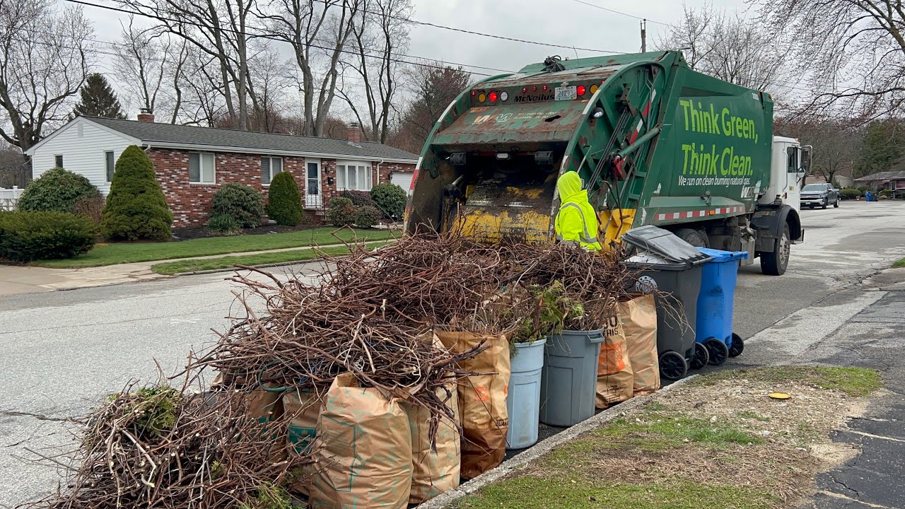 WM Garbage Truck Packing Out On Heavy Spring Yard Waste