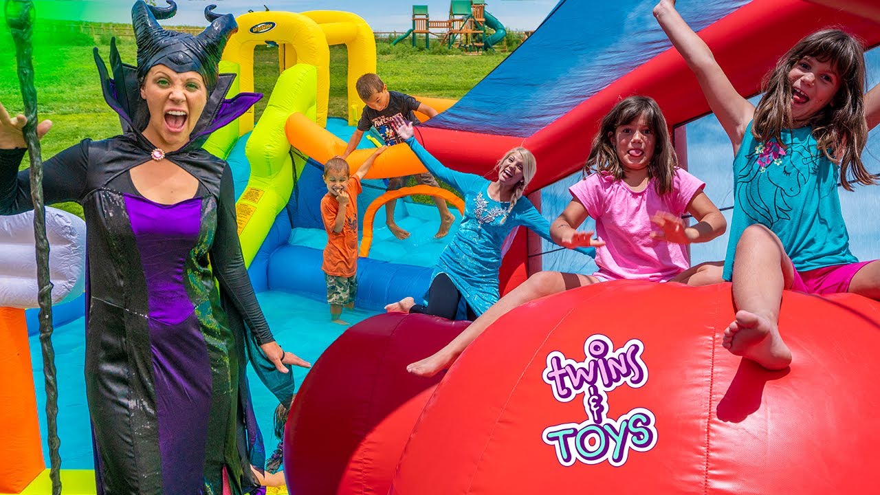 Elsa and Maleficent Surprise Twin Sisters with GIANT Inflatable Bounce Houses!