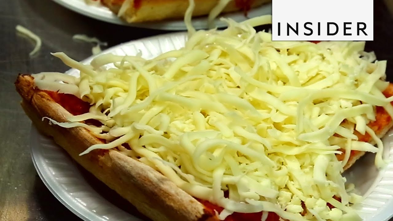 Pizza Served With A Mountain Of Cold Cheese