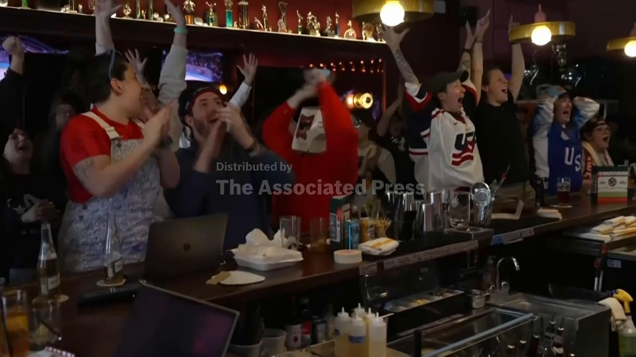 US fans react after United States wins 3rd Olympic gold in women’s hockey, beating Canada 2-1