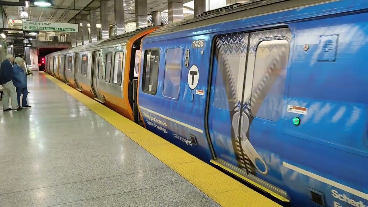 Oak Grove bound Orange line cars entering North Station + Riding to community college. Boston, MA
