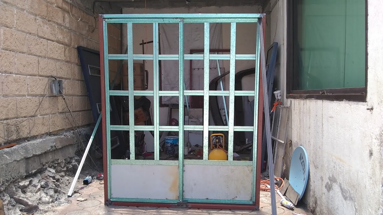 Puerta con sistema corredizo (multiservicio)