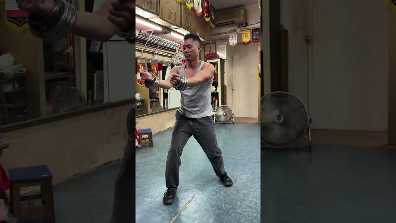 Playing around with Sam Bo Gin while using Hung Gar iron rings in Hong Kong.