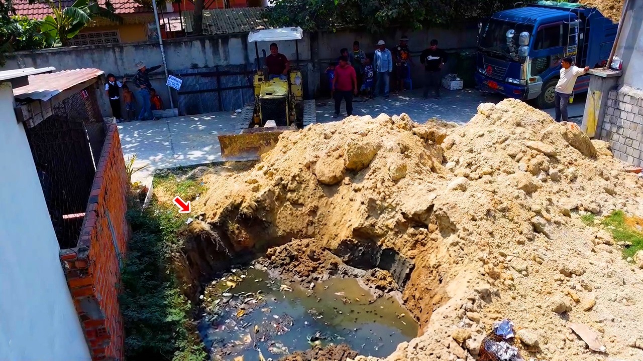 Start new project delete deep forest water to fill land by dozer pushing soil with dump truck 5Ton