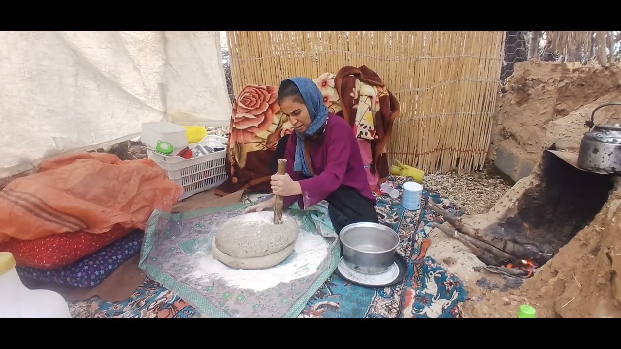 Traditional Iranian nomadic life  Crush stones in the rain and prepare local rice 💚🌧️
