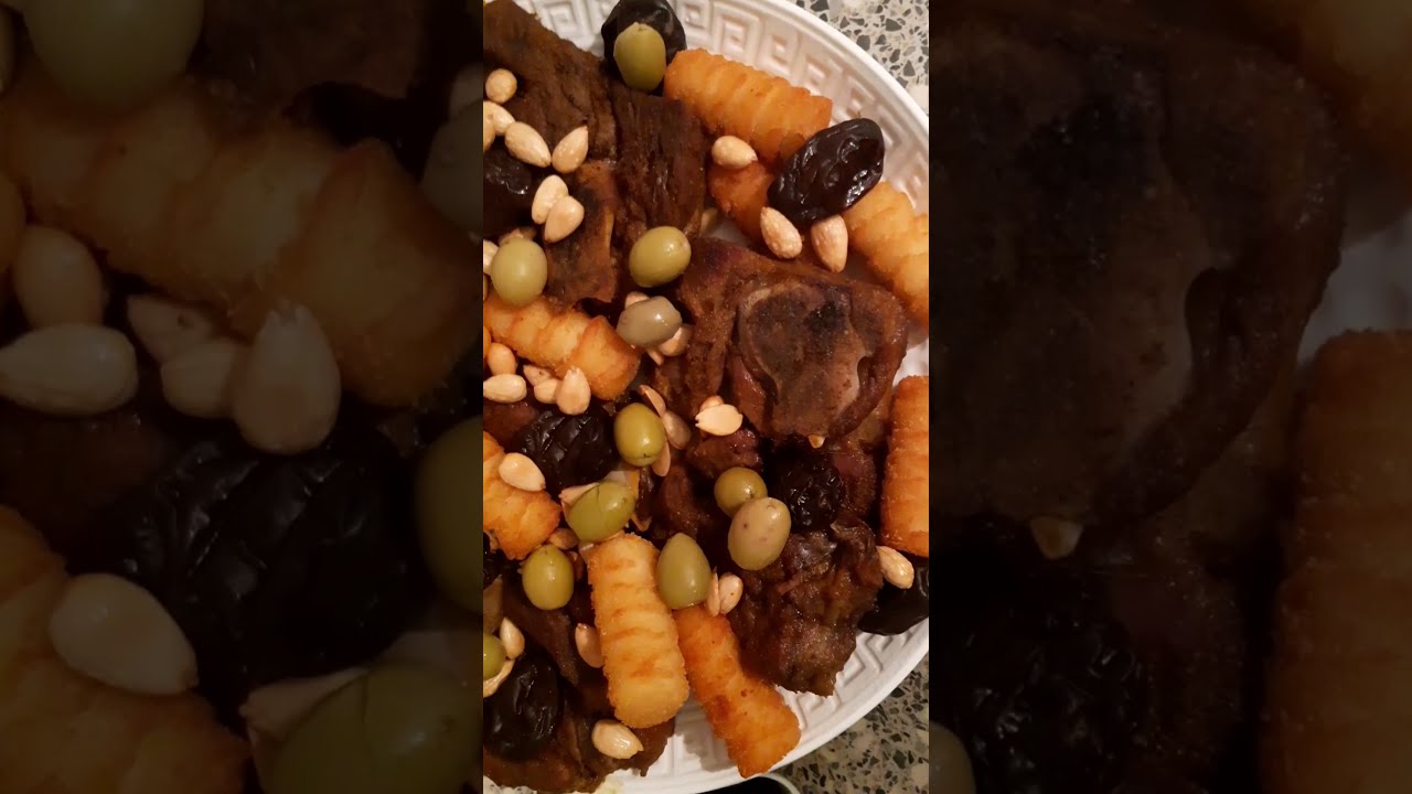 ، طبخ لحم الخروف في الفران و تزيينه باللوز و البرقوق و الزيتون
