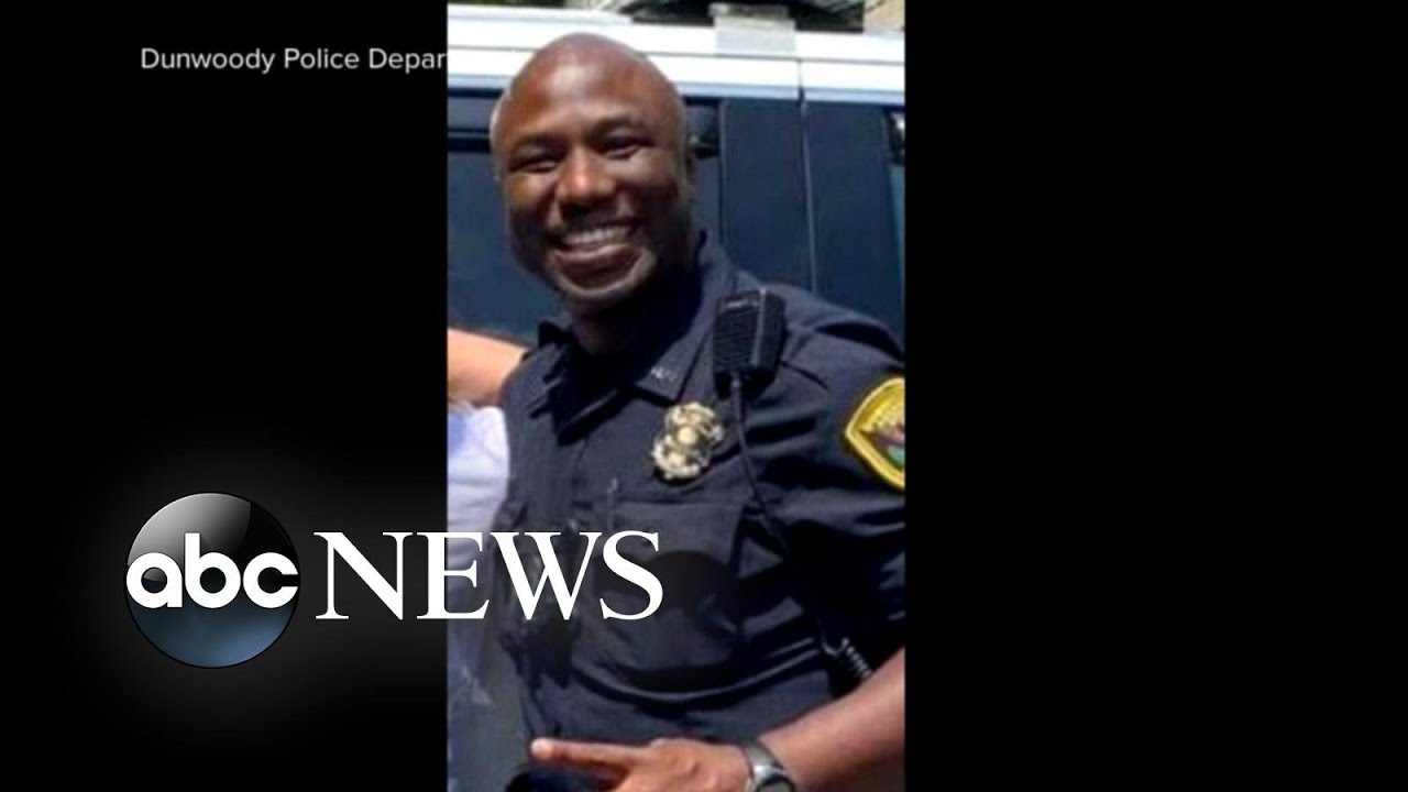 Video shows officer being dragged by car onto busy highway