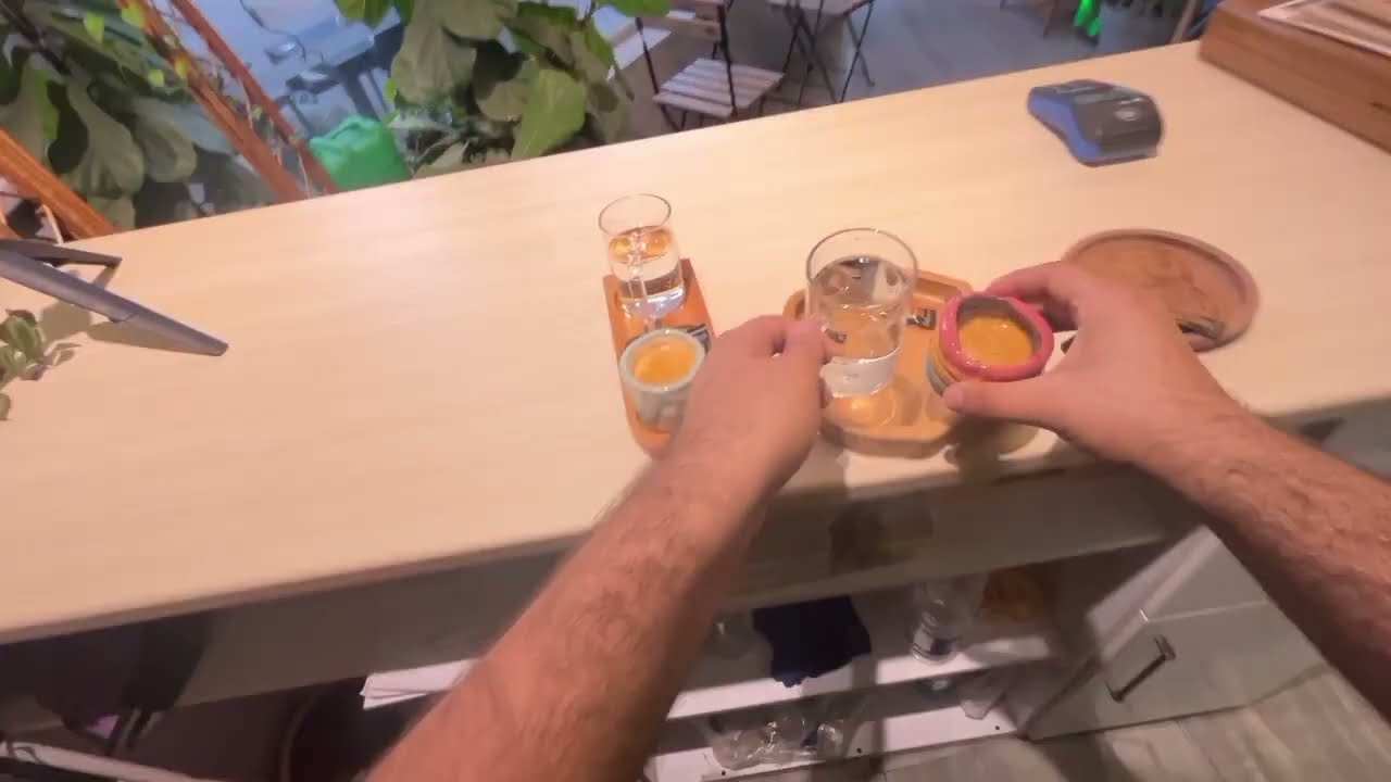 POV-A solo barista working through a calm afternoon shift