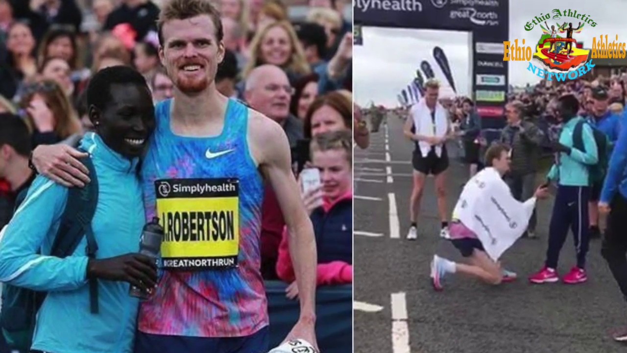 J. Robertson of New Zealand proposes to his Kenyan girlfriend,  Magdalyne, after Great North Run.