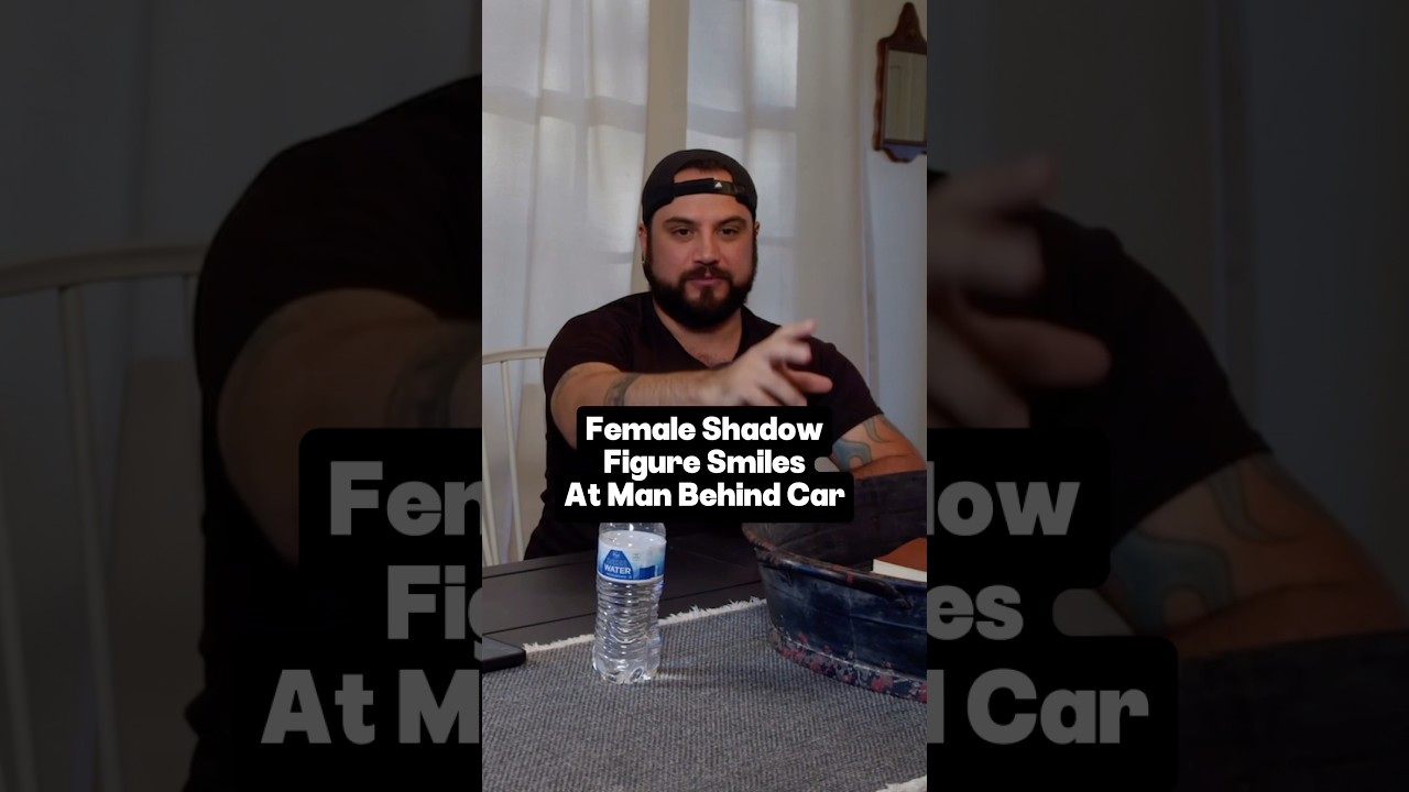 Dark Female Shadow Figure smiles at man behind car in driveway 