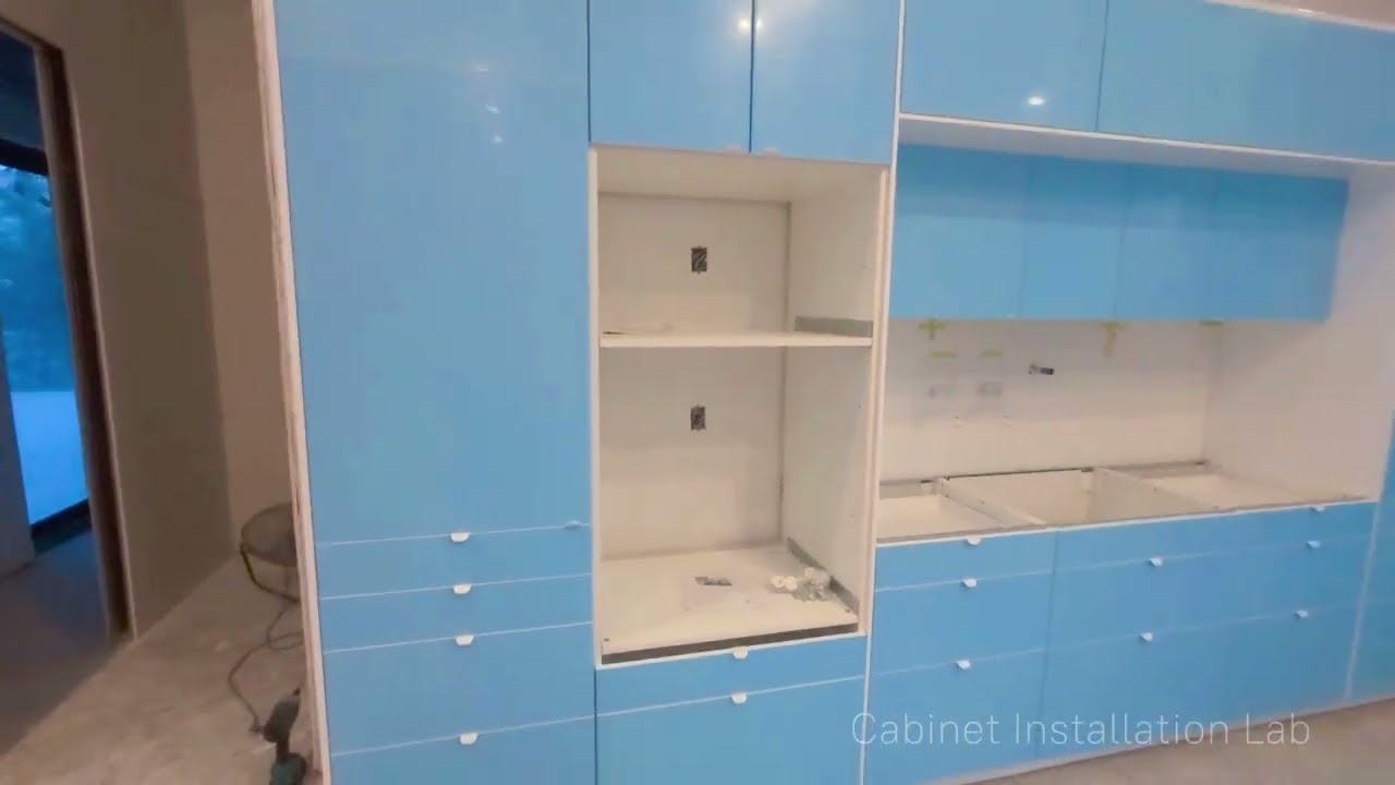 White IKEA kitchen with island assembly and installation: a start-to-finish time-lapse.