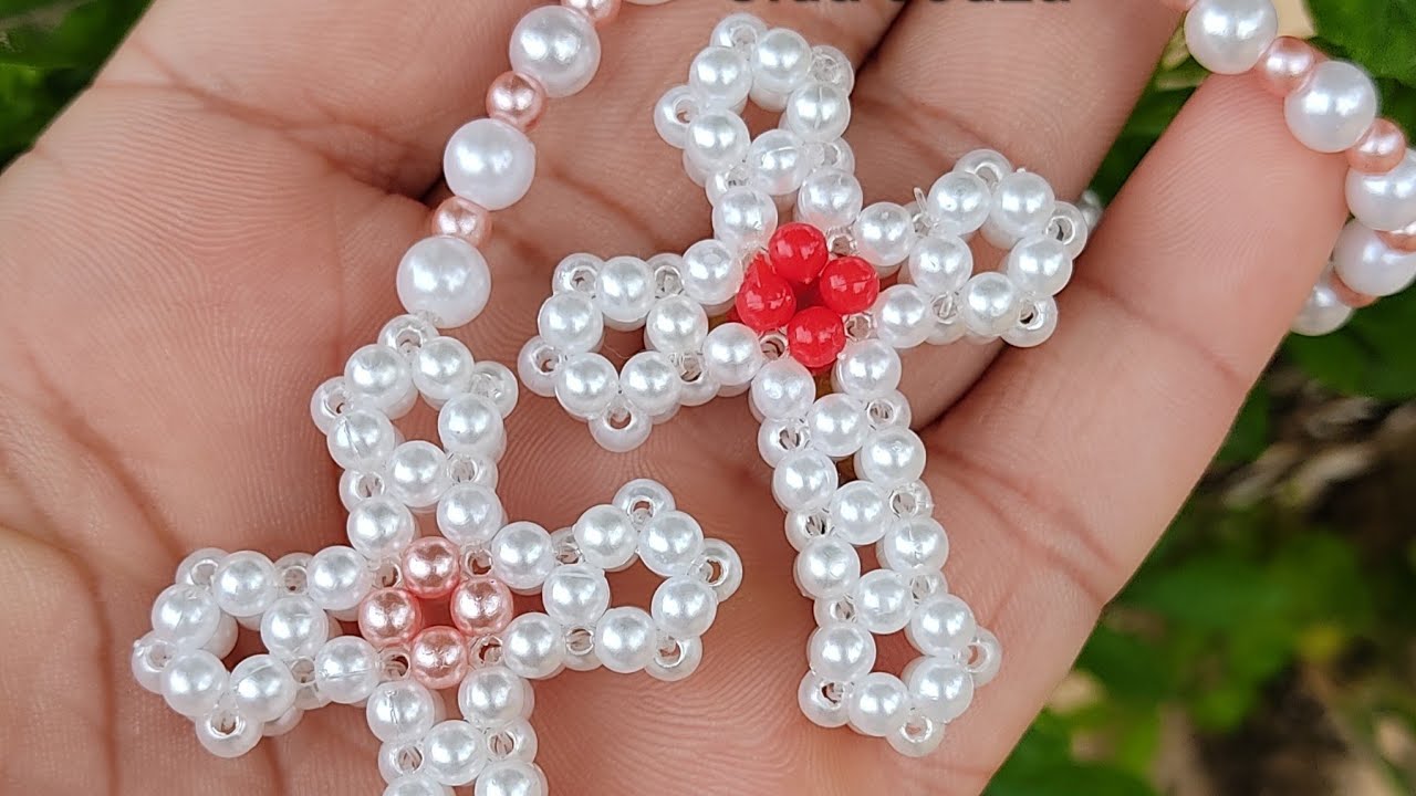 crucifixo de pérola. tá vendendo muito!!
