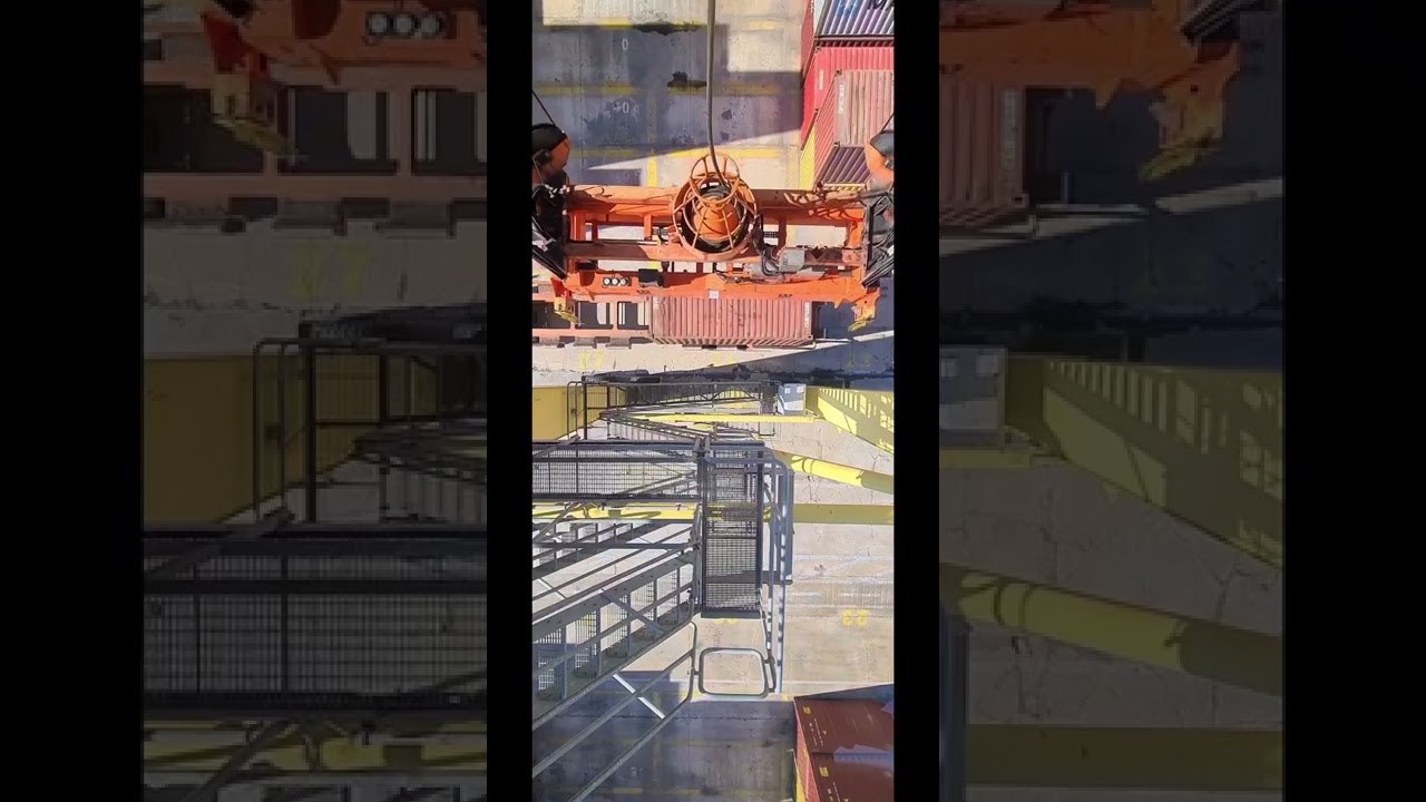 Gantry Crane - RTG Crane Operator Unloading Containers from trailers. 