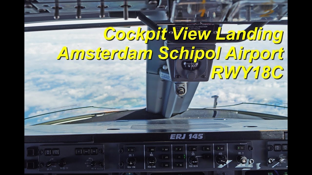 Jumpseat Cockpit View : Embraer ERJ145 Winday & Rainy Landing at Amsterdam Schipol Airport RWY18C