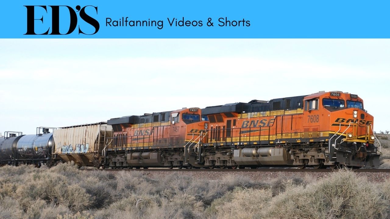 Freight Trains Hauling Containers Across Desert Landscapes