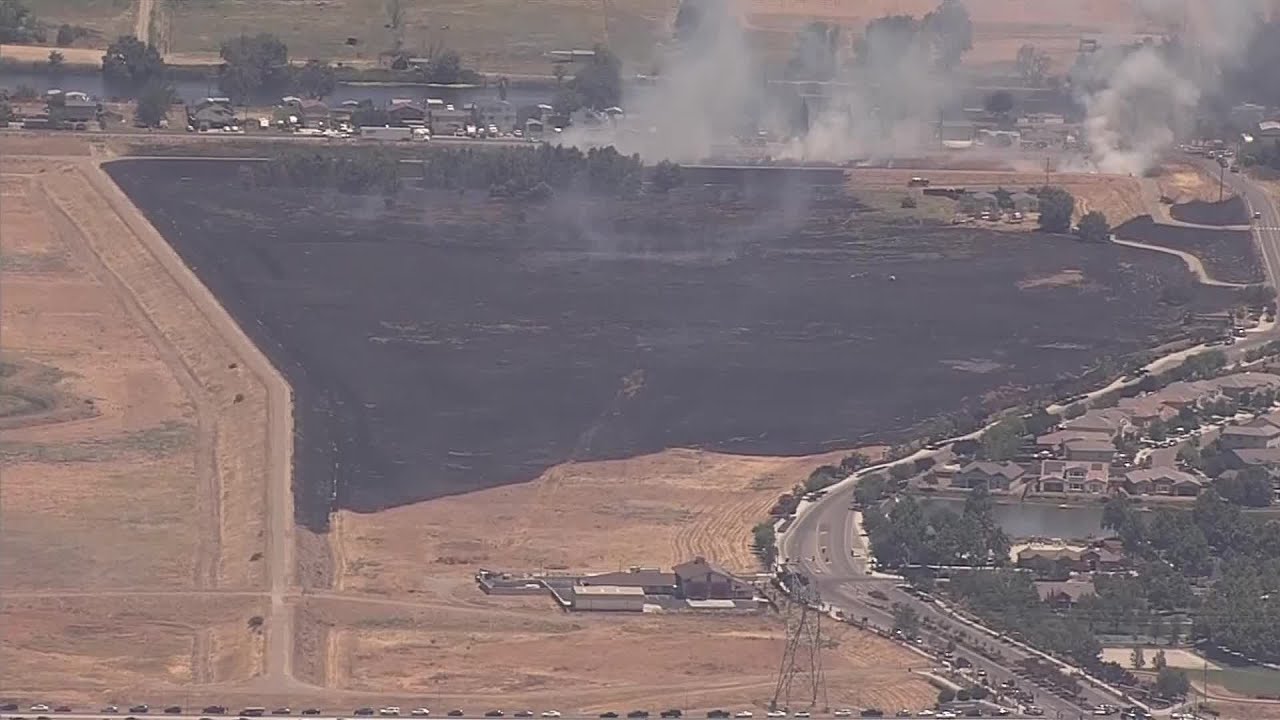 Raw Video: Grass Fire Threatens Oakley Neigborhood