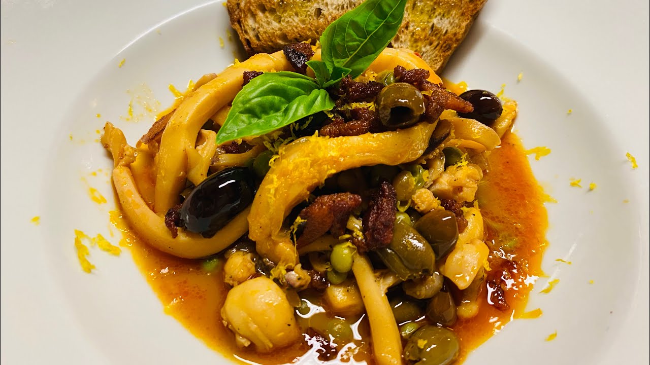 Seppie con piselli olive taggiasche e guanciale croccante