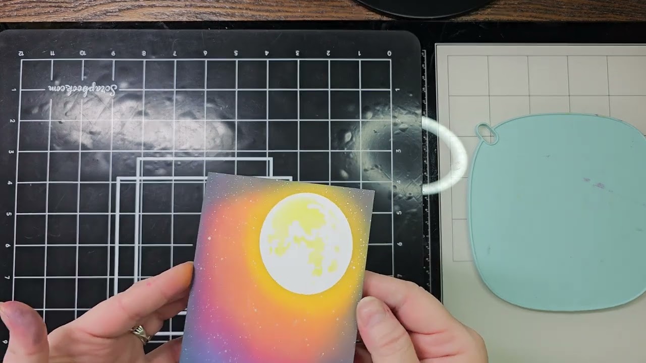 Creating a spooky Halloween card using Tim Holtz stamps.