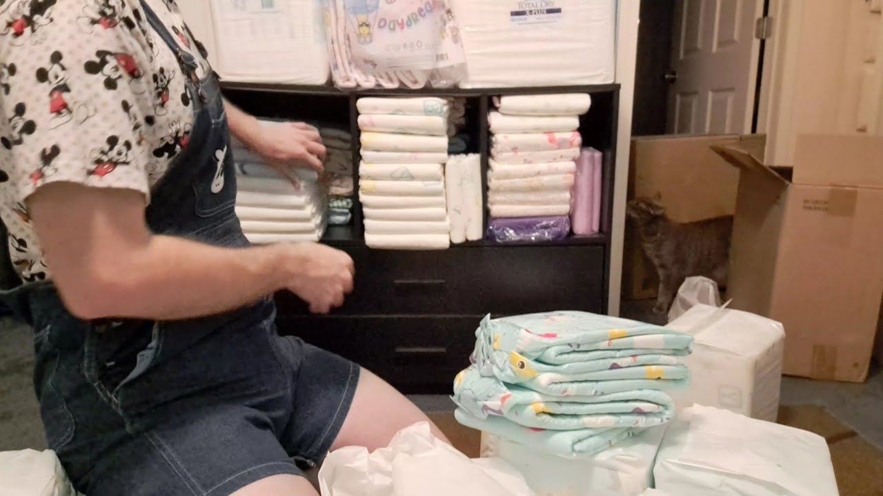 unboxing two cases of adult diapers and organizing my ABDL diaper stash in my adult baby nursery