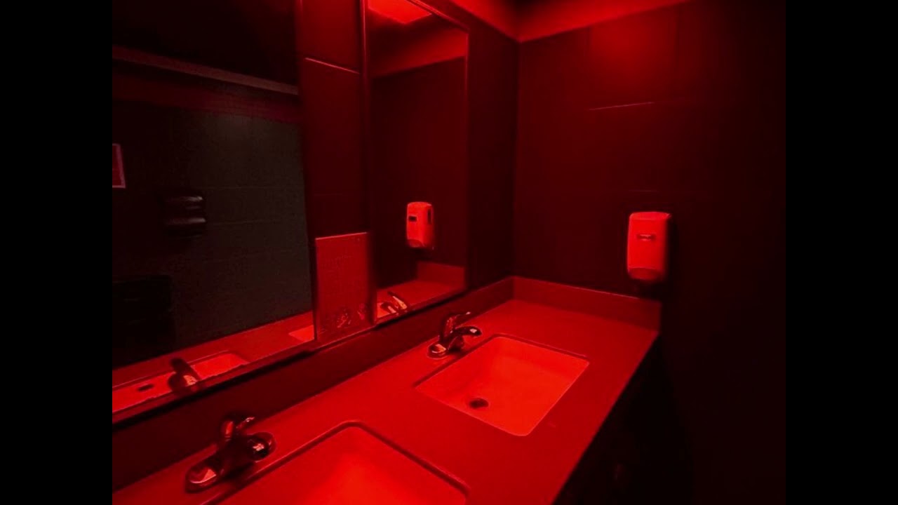 You're in the bathroom at a reggaeton party