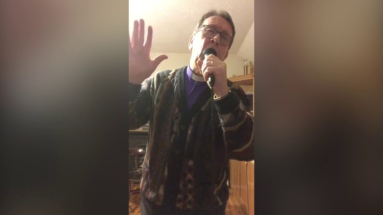 Father Ray Kelly sings You'll Never Walk Alone